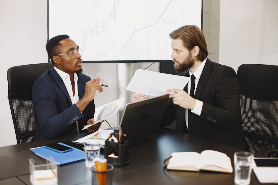 Professionals collaborating in a modern office with digital documents