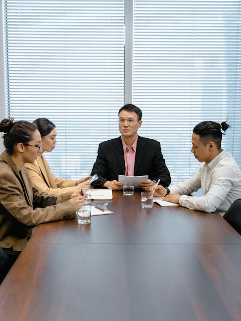 Professionals collaborating in a modern office with digital documents